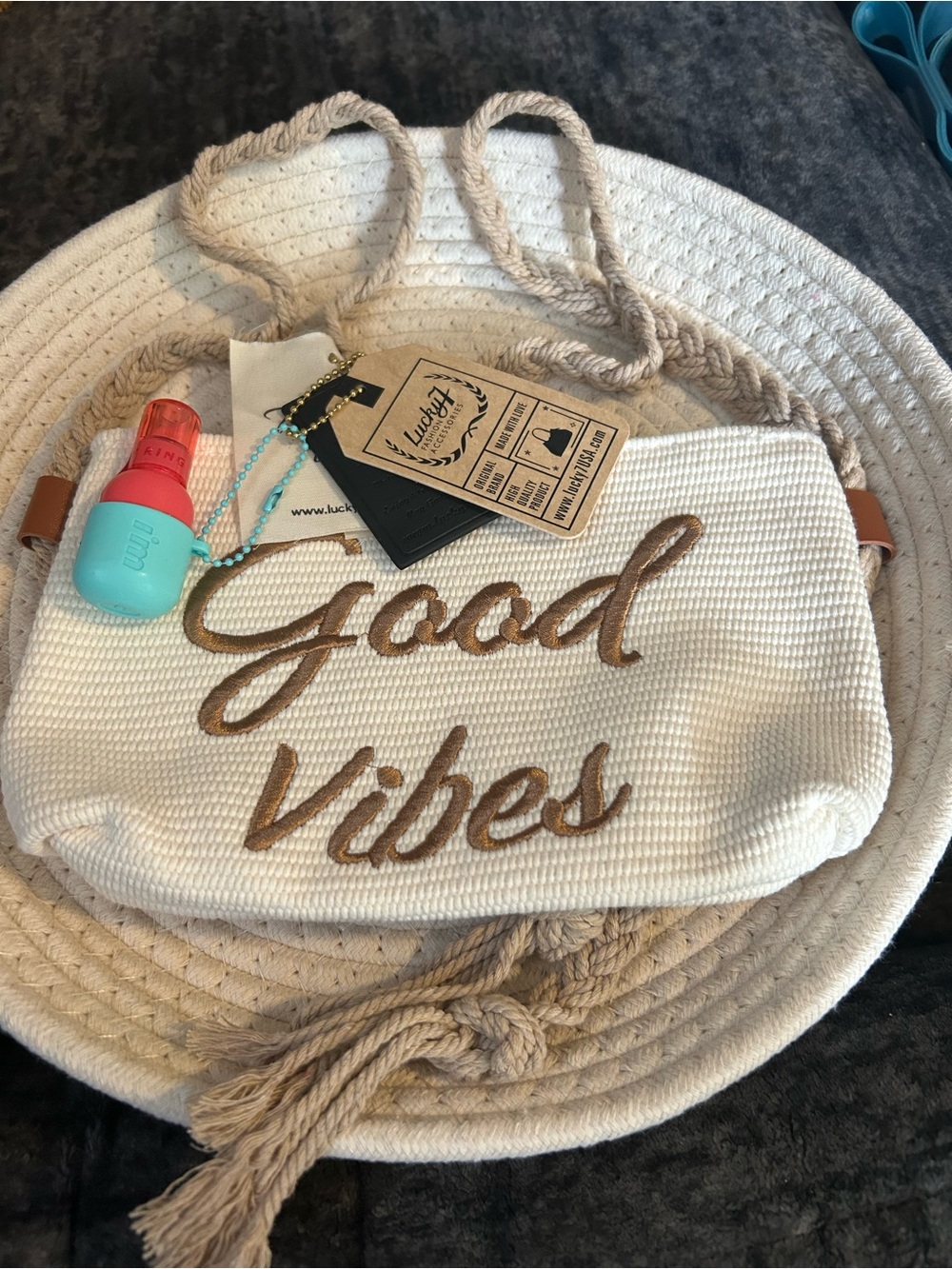 Lucky Brand Cream Woven Shoulder Bag with Tan Script and bag lip tink charm